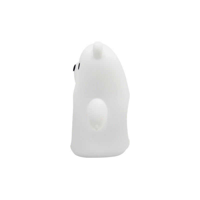 White ghost-shaped object with a small black eye on a white background