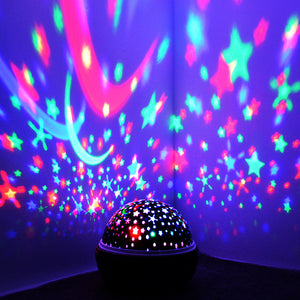 Colorful star and moon projector on a dark background