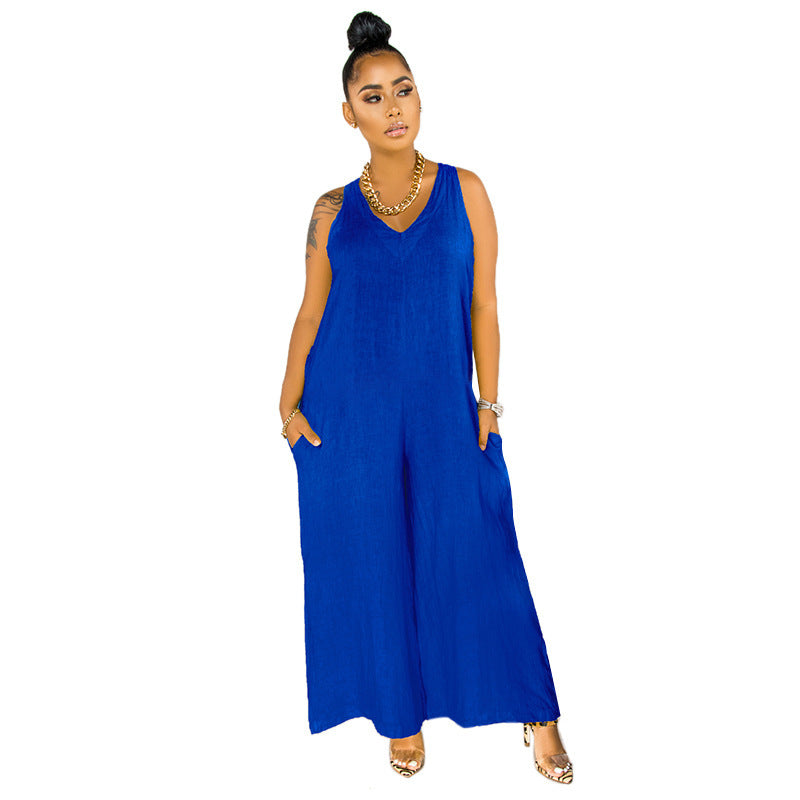 Woman wearing a blue sleeveless jumpsuit on a white background