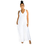 Woman wearing a white sleeveless jumpsuit on a white background