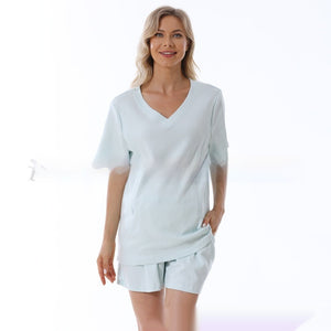 Woman wearing a light blue outfit on a white background