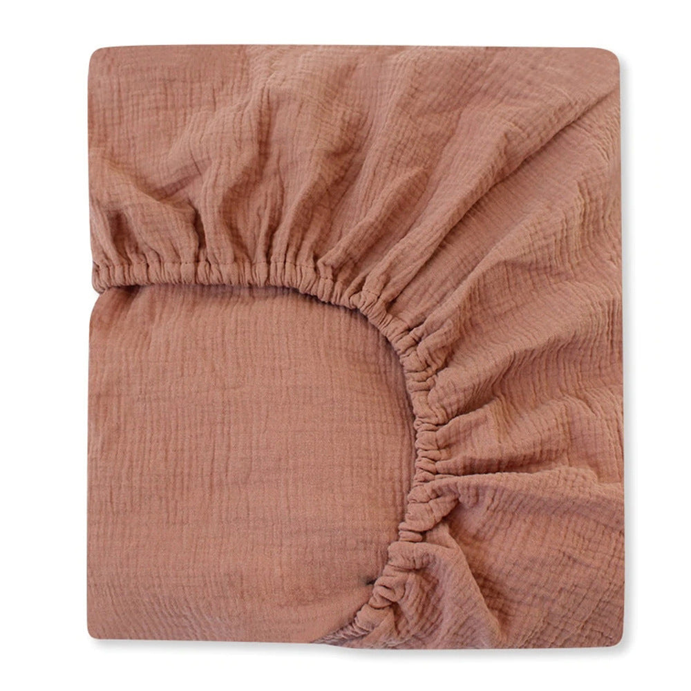 Brown textured fitted sheet on a white background