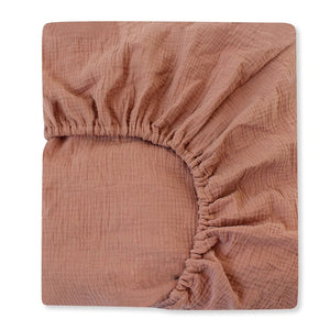Brown textured fitted sheet on a white background