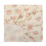 Floral patterned quilt on a white background