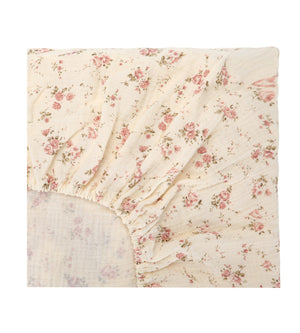 Floral patterned fitted sheet on a white background