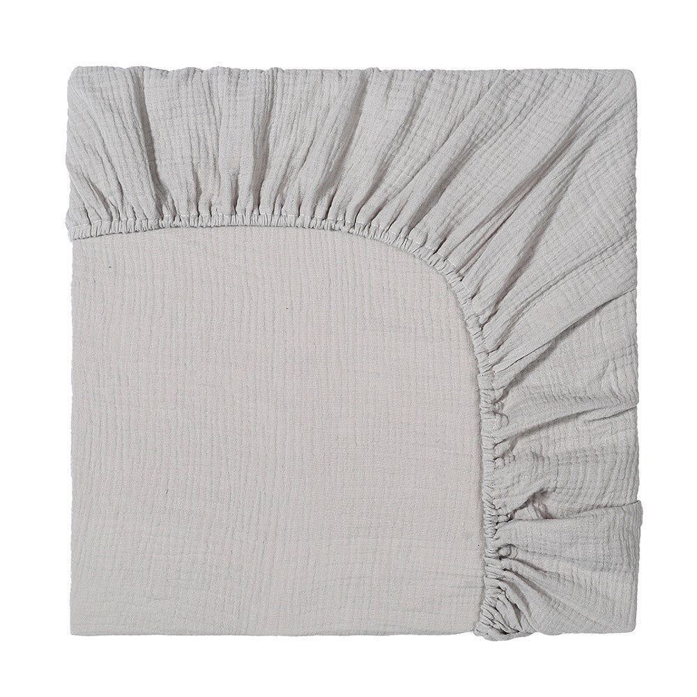 Gray fitted sheet on a white background
