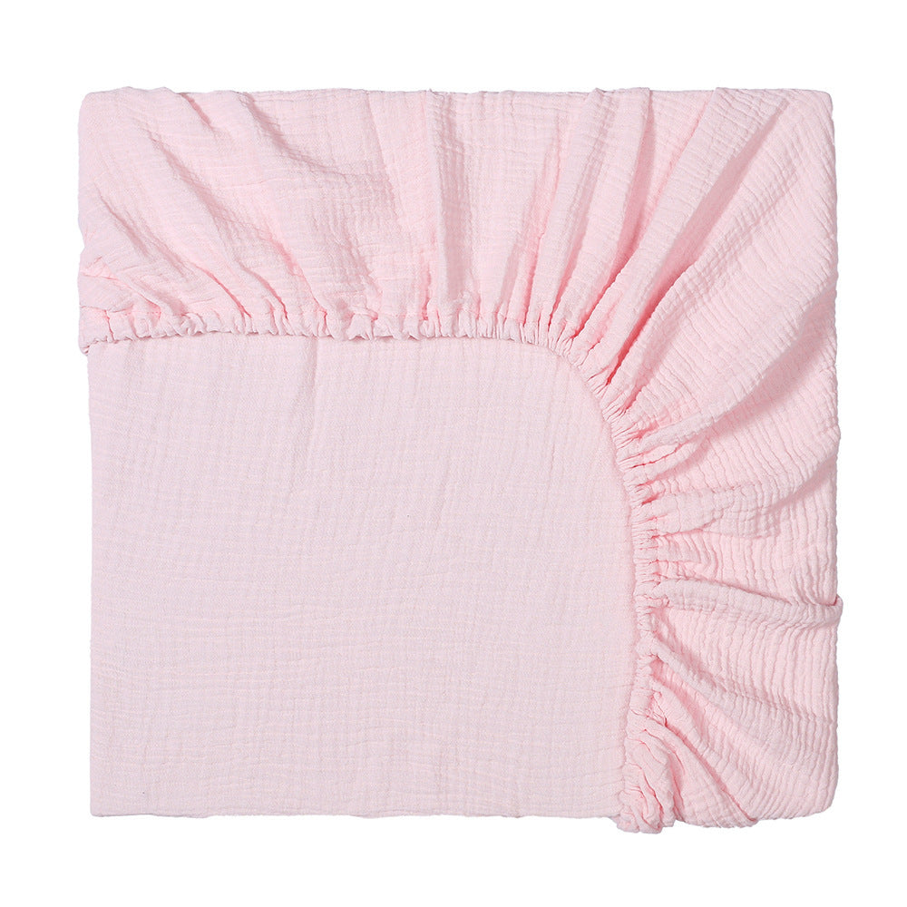 Pink fitted sheet on a white background
