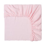Pink fitted sheet on a white background