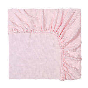 Pink fitted sheet on a white background