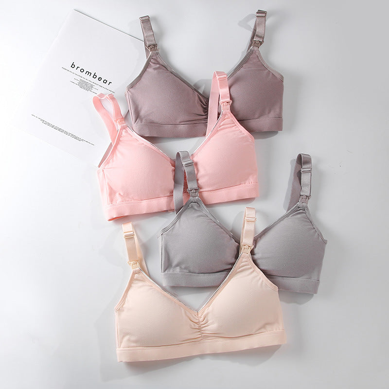 Set of four bras in different colors on a white background