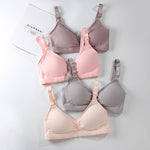 Set of four bras in different colors on a white background