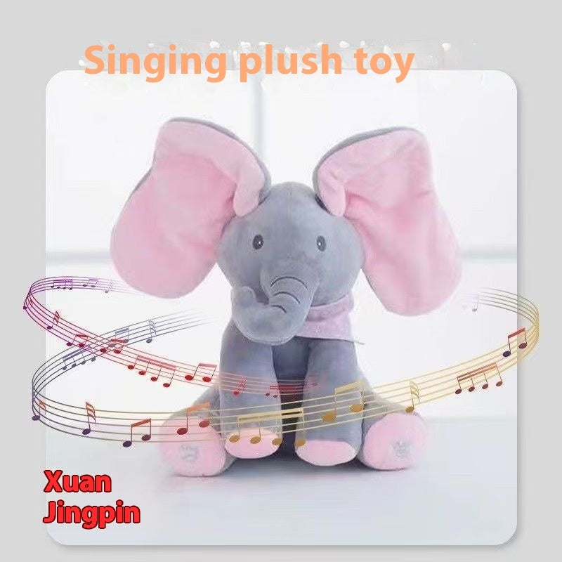 Plush toy elephant with pink ears and musical notes around it, labeled 'Singing plush toy' and 'Xuan Jingpin'.