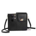 Black crossbody bag with gold accents on a white background