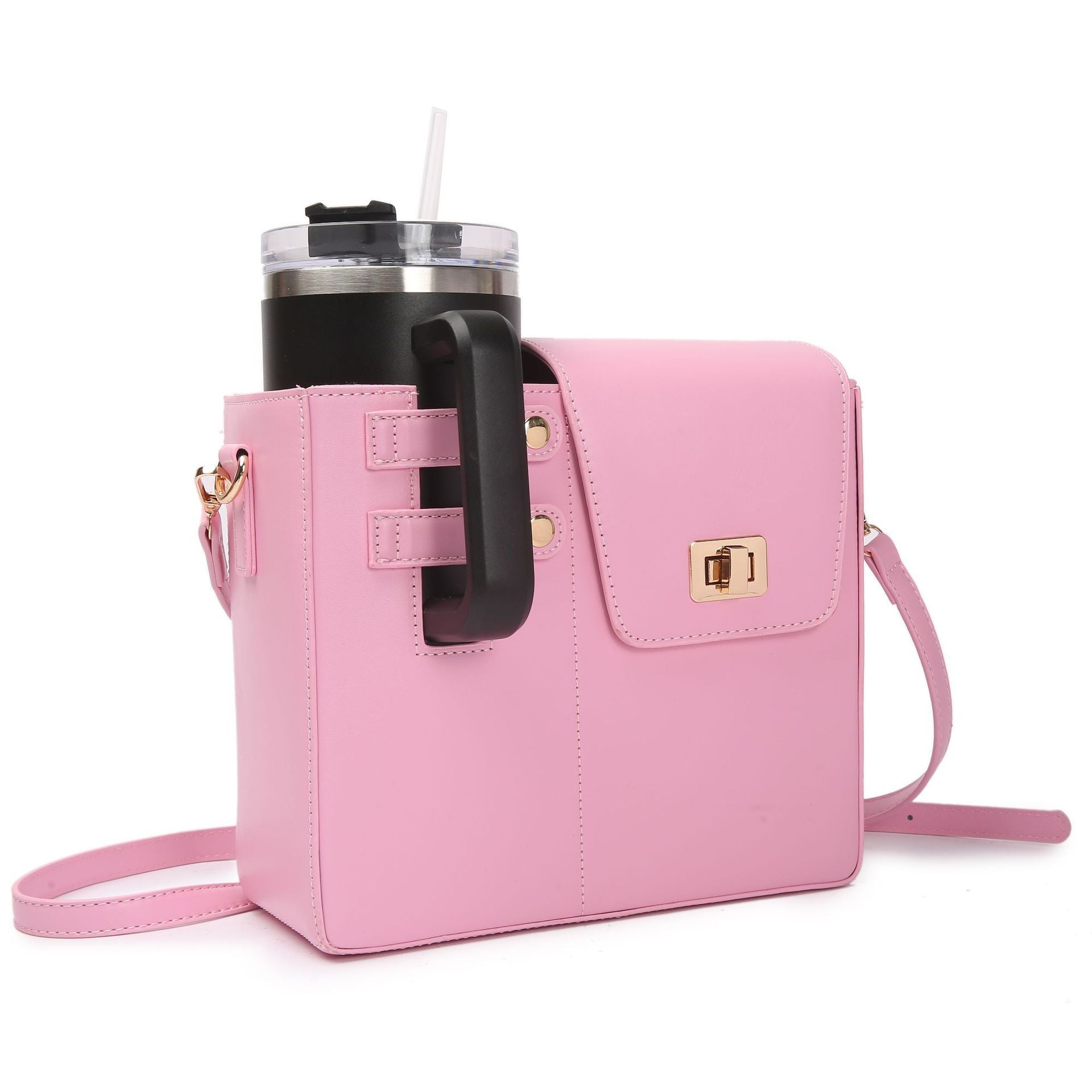 Pink crossbody bag with a black handle holding a clear cup with a straw on a white background