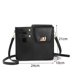 Black crossbody bag with measurements on a white background