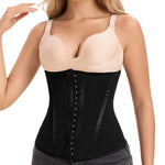 Woman wearing a black waist trainer with beige top on a white background