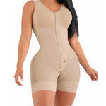 Beige shapewear garment worn by a model on a white background