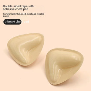 Two beige triangle-shaped chest pads on a light pink background with text describing the product.