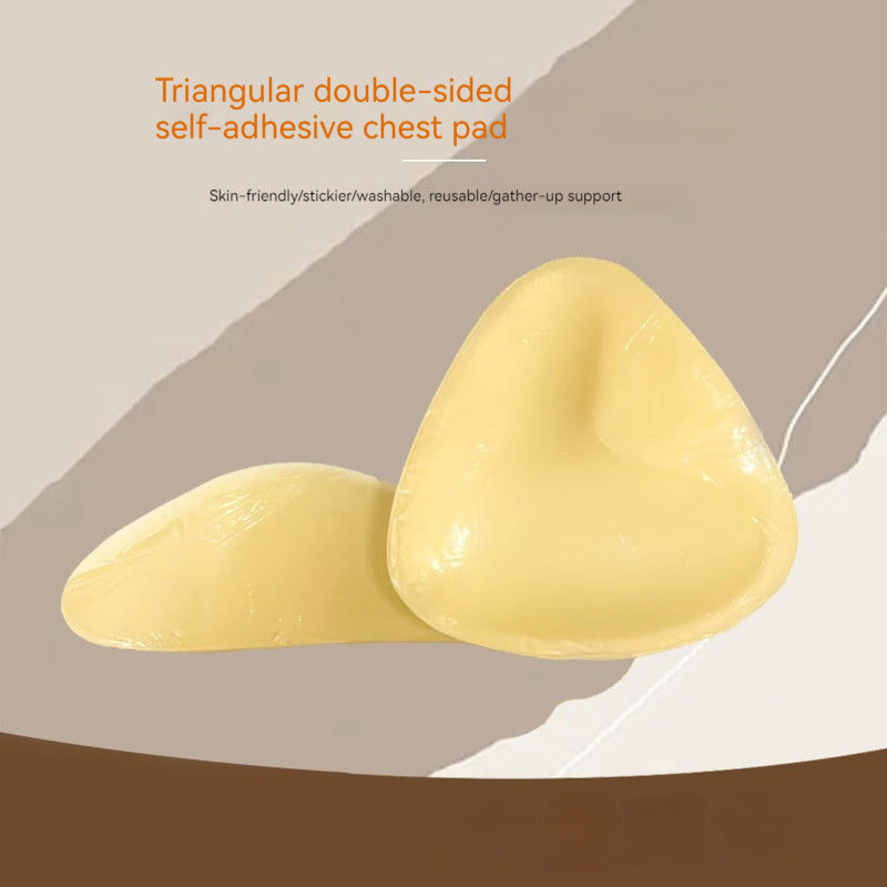 Triangular double-sided self-adhesive chest pad on a beige background