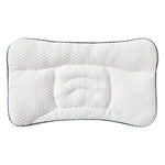 White pillow with black border on a white background