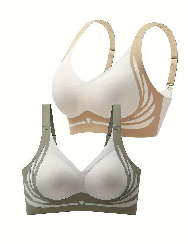 Two bras, one beige and one green, on a white background
