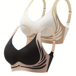 Two bras, one black and one beige, on a white background