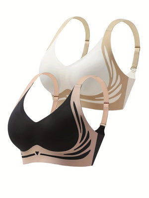 Two bras, one black and one beige, on a white background