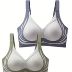 Two bras, one gray and one green, on a white background