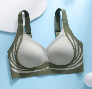 Gray bra with green straps on a light blue background