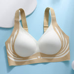 Beige and white bra on a light blue background