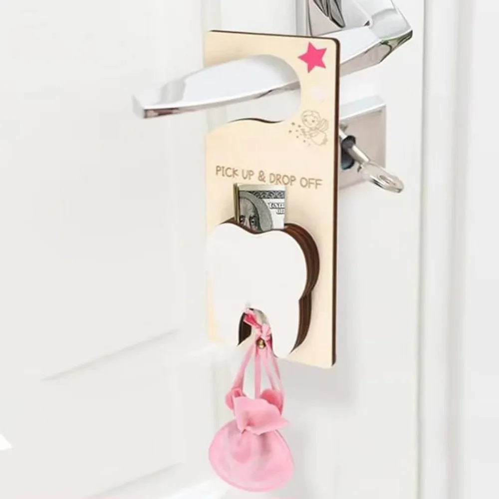 Gold key holder with pink star and 'Pick Up & Drop Off' text on a white door.