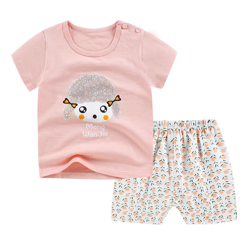 Children's outfit with pink shirt and patterned pants on a white background