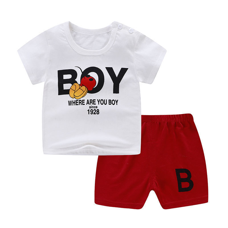 Children's outfit with white t-shirt and red shorts on a white background