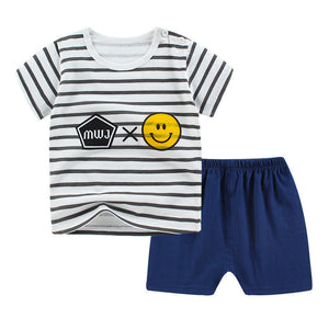 Children's outfit with striped shirt and blue shorts on a white background