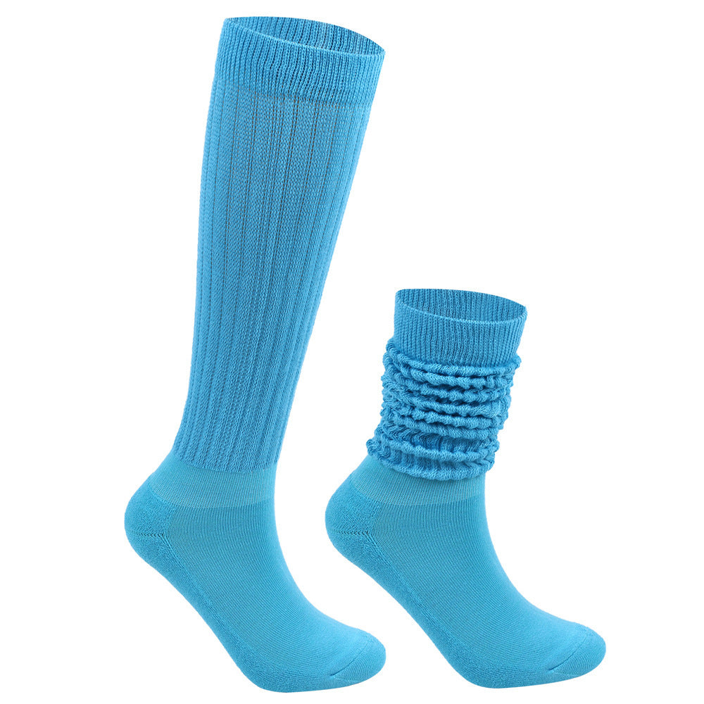 Two blue socks, one knee-high and one ankle-high, on a white background