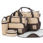 Set of baby bags including a large diaper bag, smaller pouches, and a changing mat on a white background.