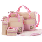 Set of pink and beige bags with a teddy bear design on a white background