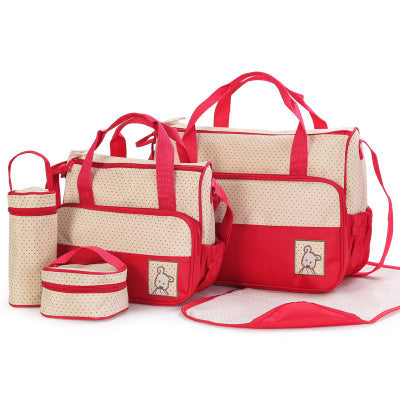 Set of red and beige diaper bags on a white background