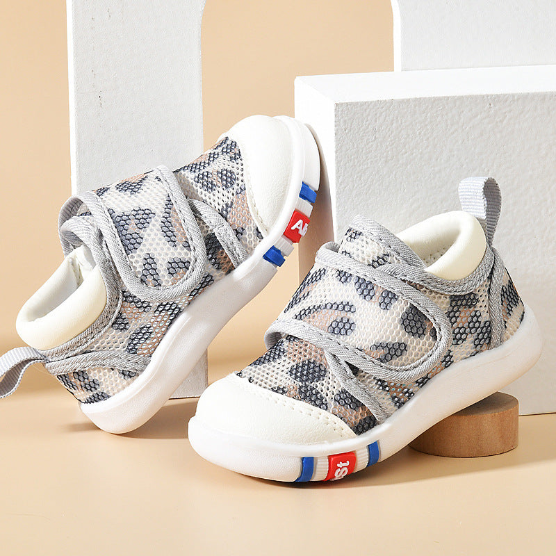 Children's sneakers with patterned design on a neutral background