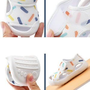 Collage of baby shoes with colorful patterns held by a hand.
