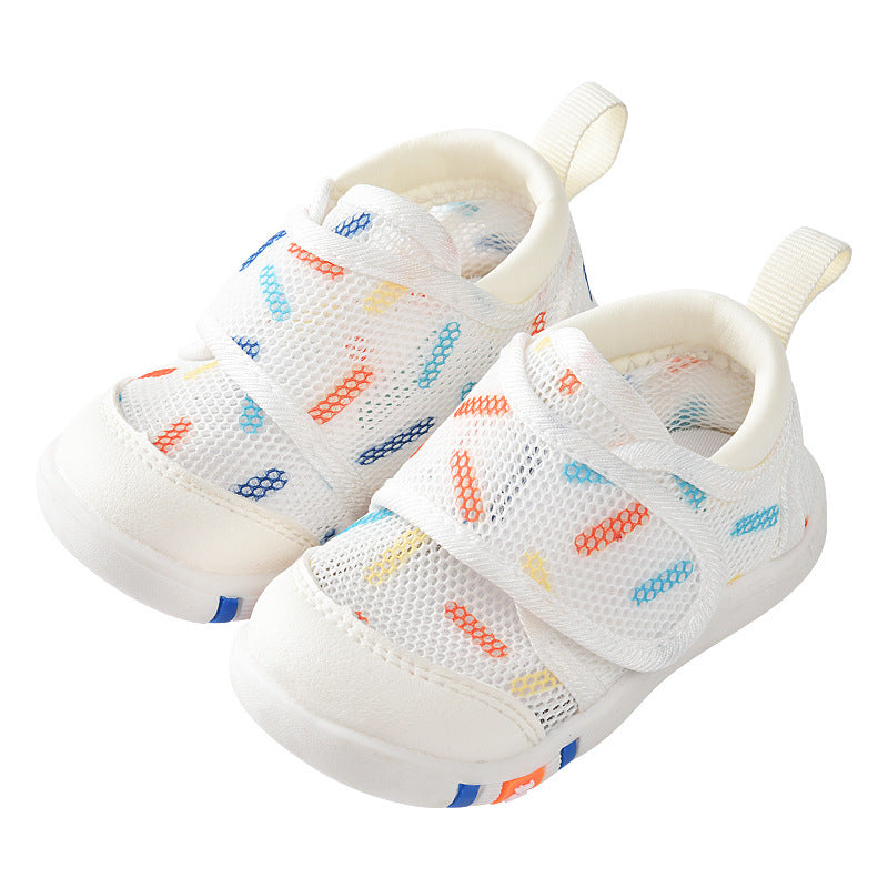 White children's sneakers with colorful patterns on a white background