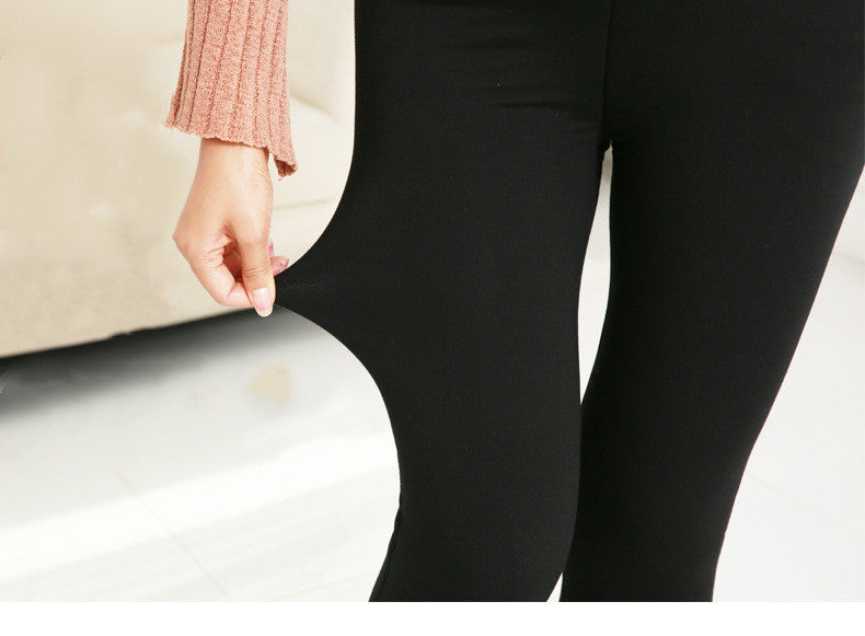 Black leggings worn by a person with a blurred background