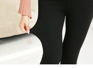 Black leggings worn by a person with a blurred background