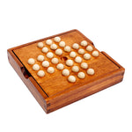 Wooden game board with white pieces on a white background