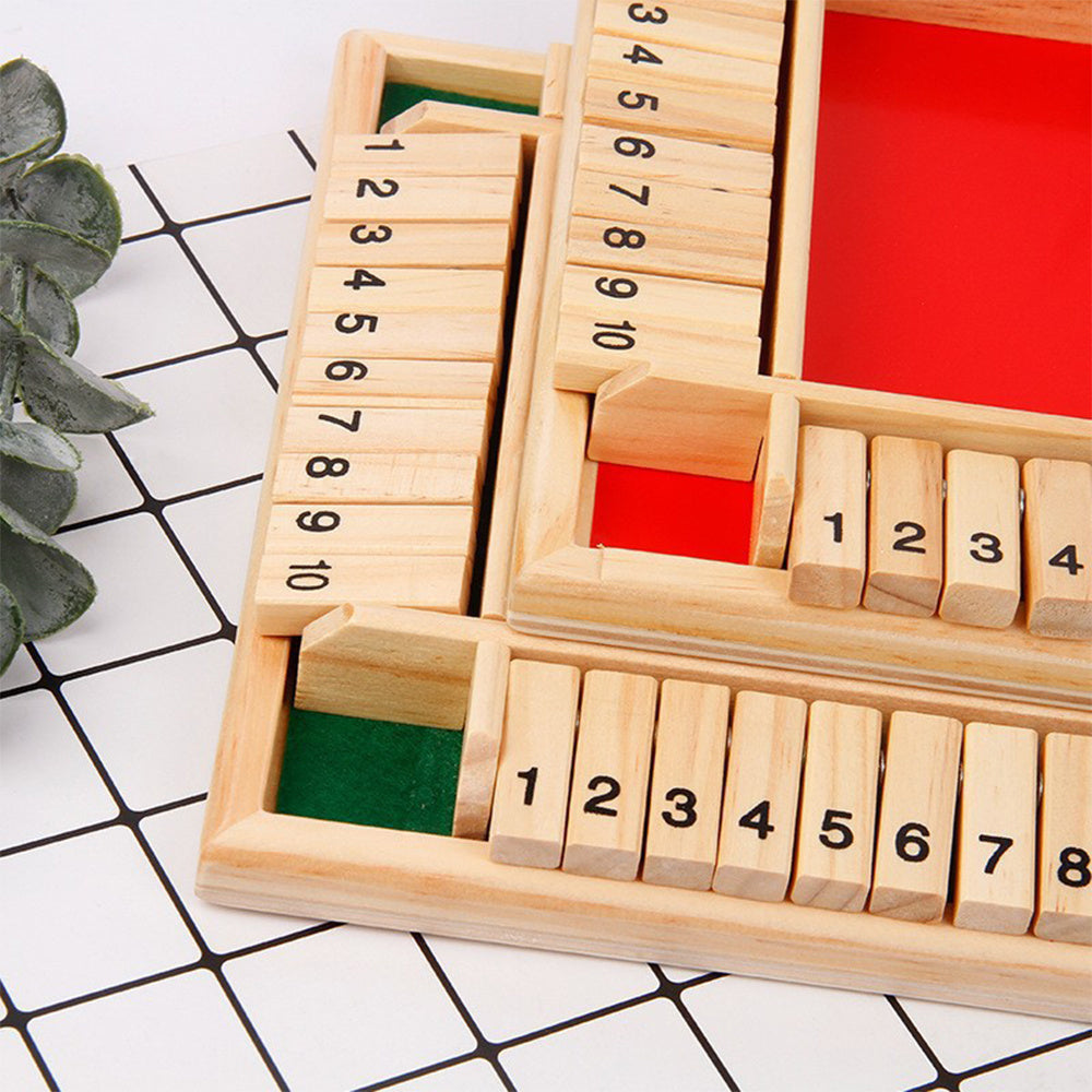 Wooden number blocks with red and green sections on a white and black grid background