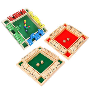 Set of wooden dice games with green, red, and yellow sections on a white background