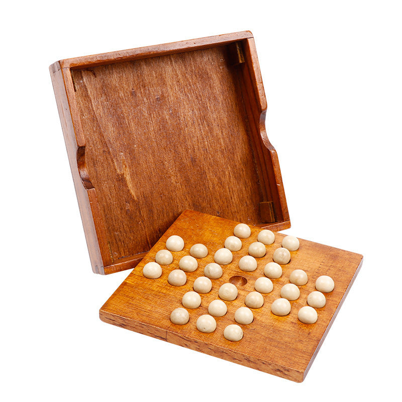 Wooden game board with white pieces and open wooden box on a white background