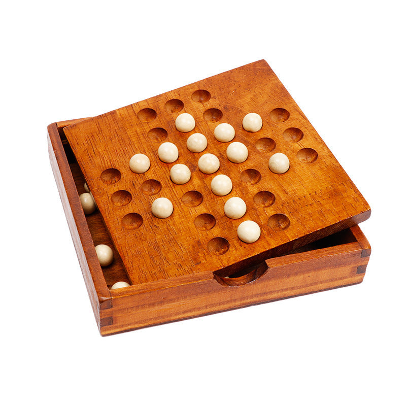 Wooden game board with holes and white pieces on a white background